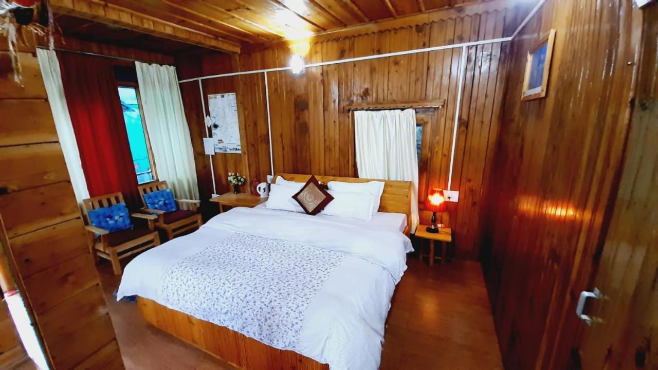 Ishan Log Huts-A Boutique Home Stay Banjār Esterno foto