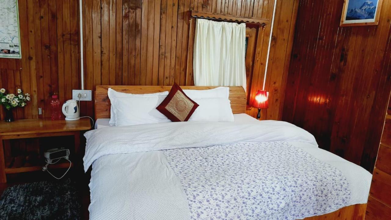 Ishan Log Huts-A Boutique Home Stay Banjār Esterno foto