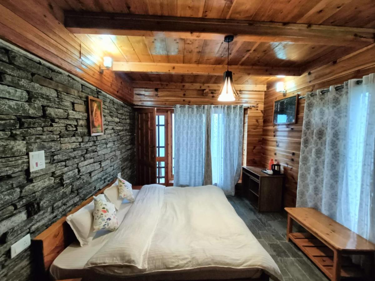 Ishan Log Huts-A Boutique Home Stay Banjār Esterno foto